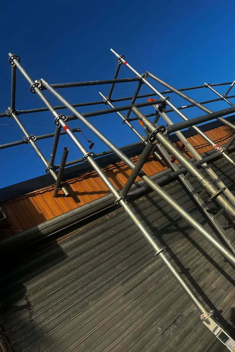 Scaffolding and edge protection set up for a Delta Roofing re-roof