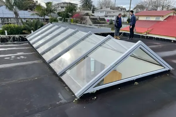 New glazed skylights installed in a flat commercial roof